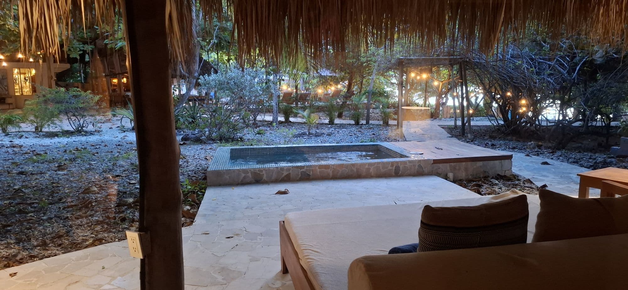 The workshop setting at Blue Apple Beach — a plunge pool and shaded terrace among tropical greenery.